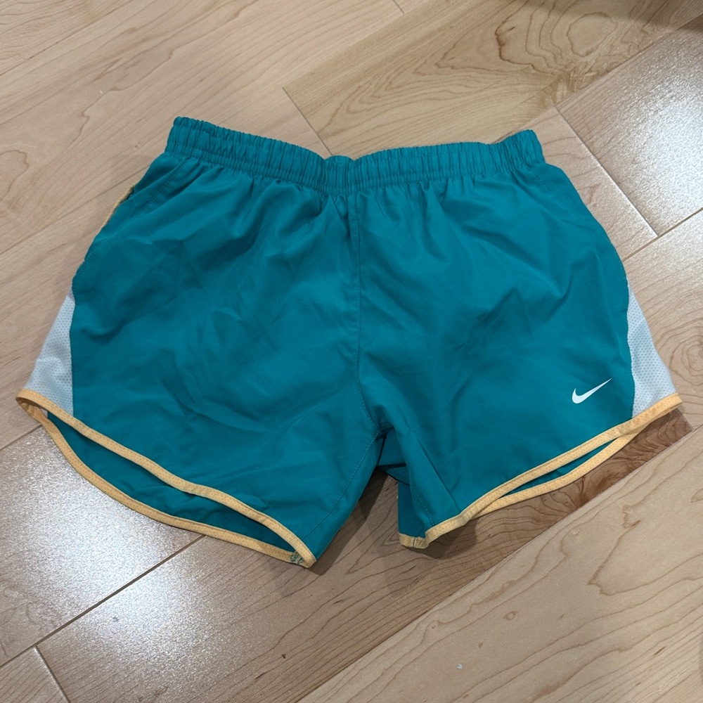 Nike Turquoise Shorts with White and Gold Trim